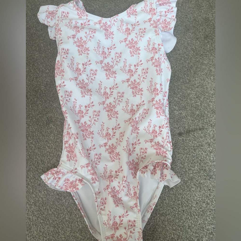 Minnow floral Nantucket one piece with ribbon tie at the back.